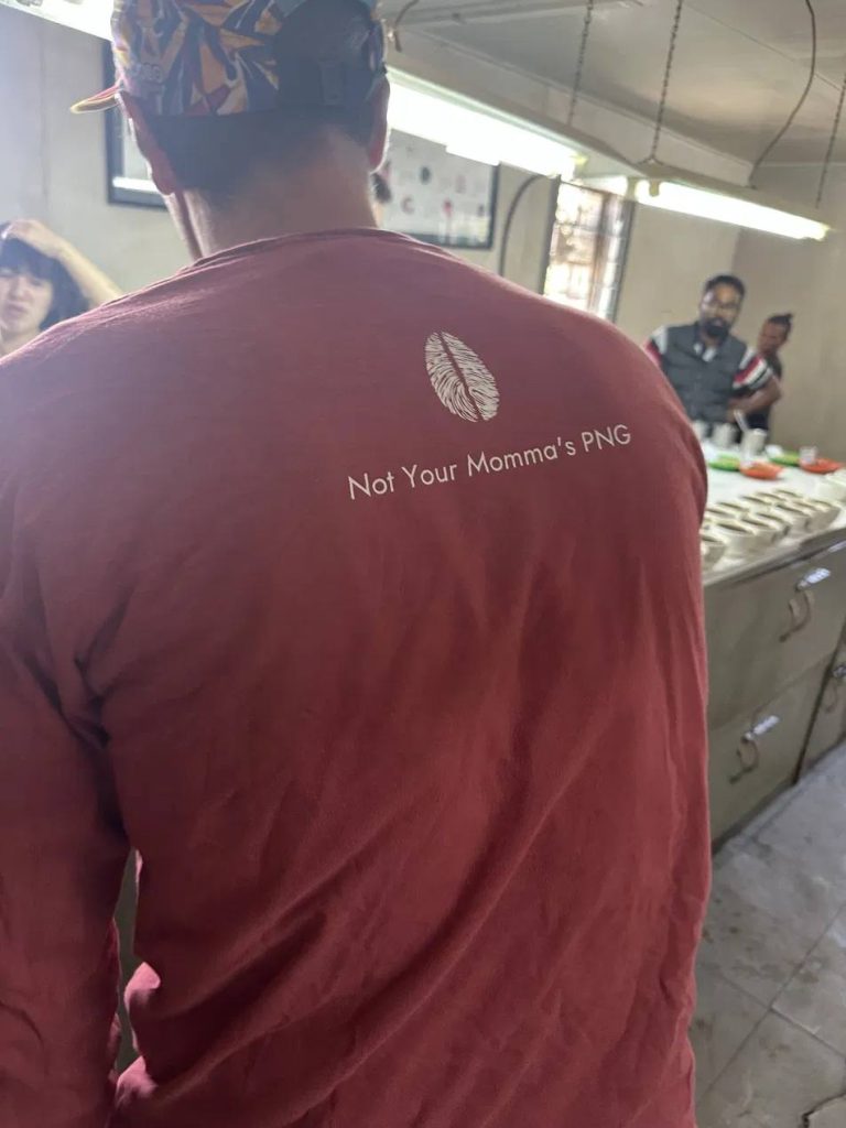 Benchmark team member wearing a Kula-branded shirt
